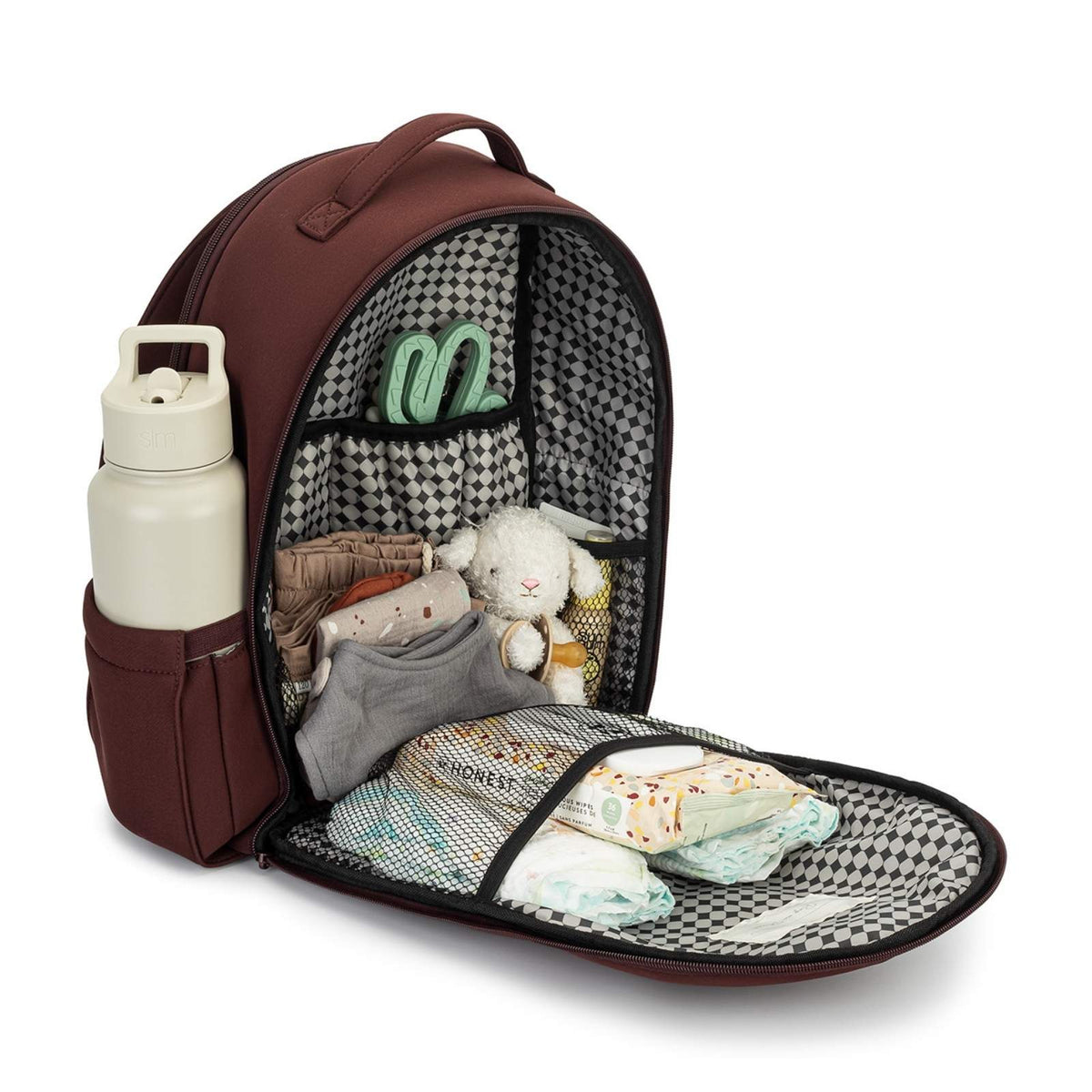 Open baby backpack with items including a bottle, clothes, and a toy on a white background