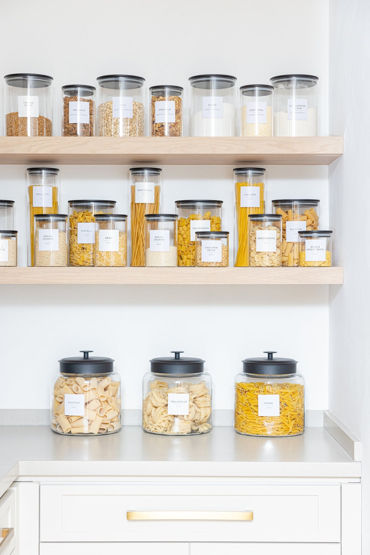 Organized pantry with Savvy and Sorted white minimalist labels on glass jars