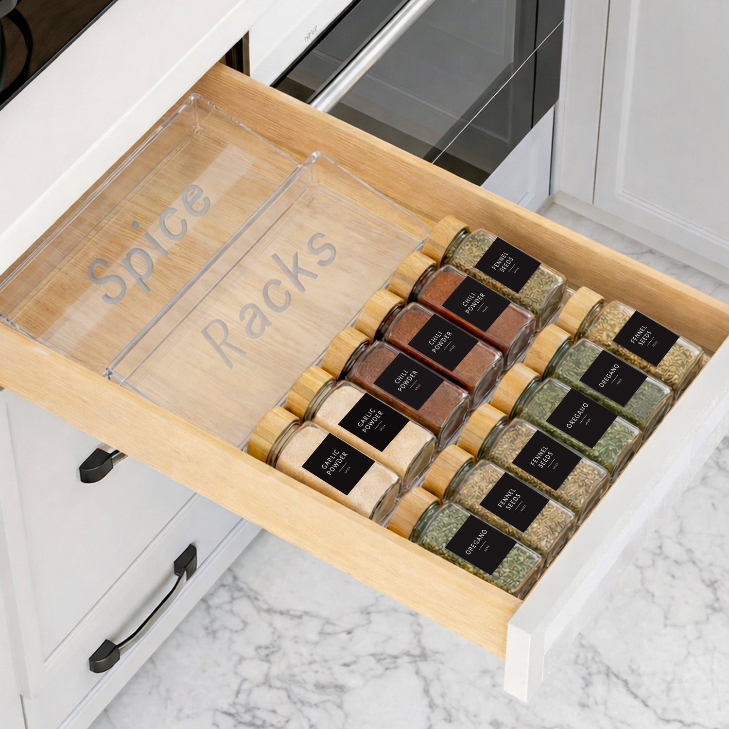 Acrylic spice rack organizer with labeled glass spice jars arranged in tiers