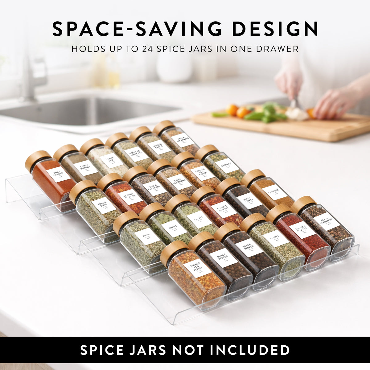 Open kitchen drawer with glass spice jars on acrylic racks, ready to fill and label