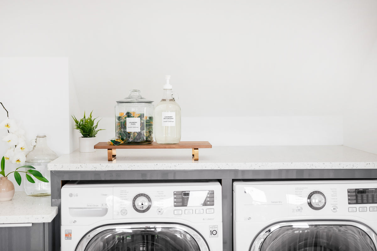 Savvy & Sorted White Minimalist Home & Laundry Labels on glass containers above front-loading washing machines - St. Augustine 2023