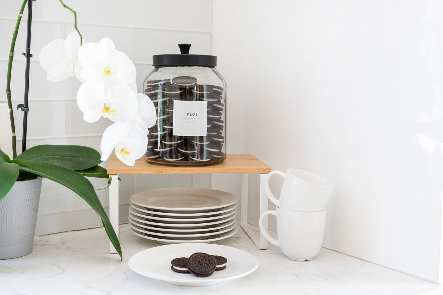 Minimalist pantry labels on glass jars in an organized kitchen pantry