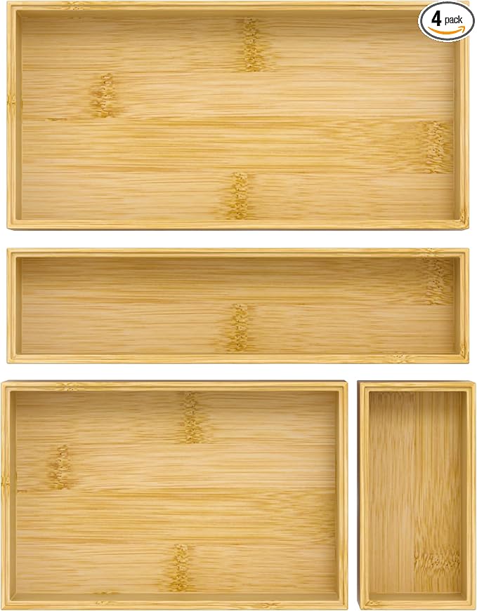 Set of four bamboo trays with a natural finish on a white background.