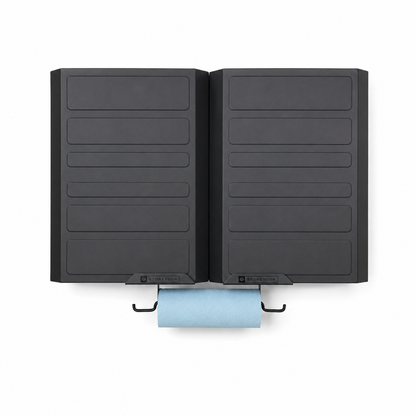 Black wall-mounted towel holder with a blue towel on a white background