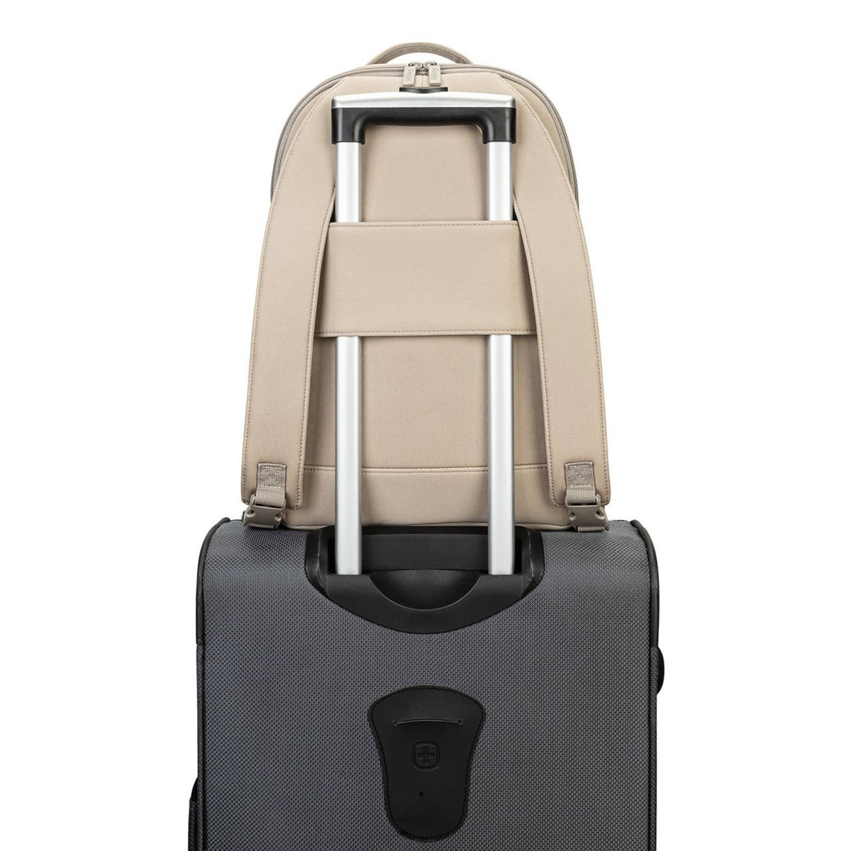 Beige backpack with silver straps attached to a black suitcase on a white background