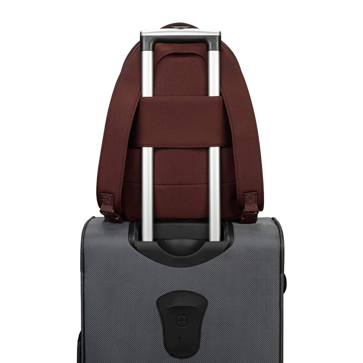 Brown backpack attached to a gray suitcase on a white background
