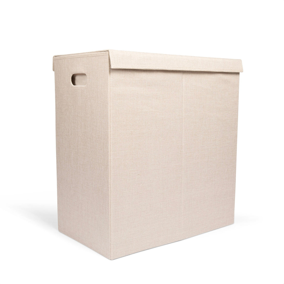 Beige laundry basket with a lid on a white background