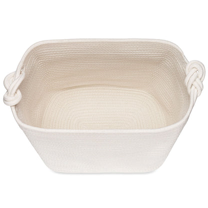 Beige woven basket with handles on a white background