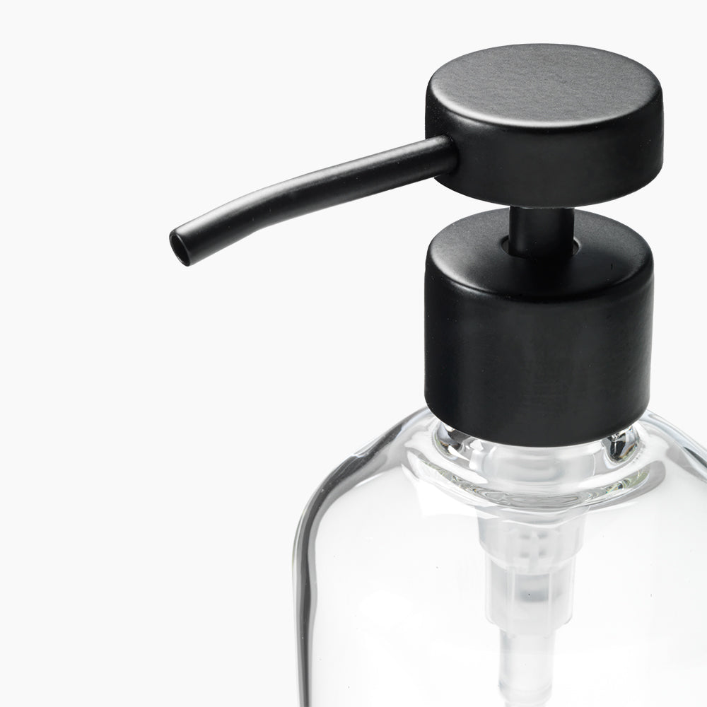 Black pump dispenser on a clear bottle with a white background
