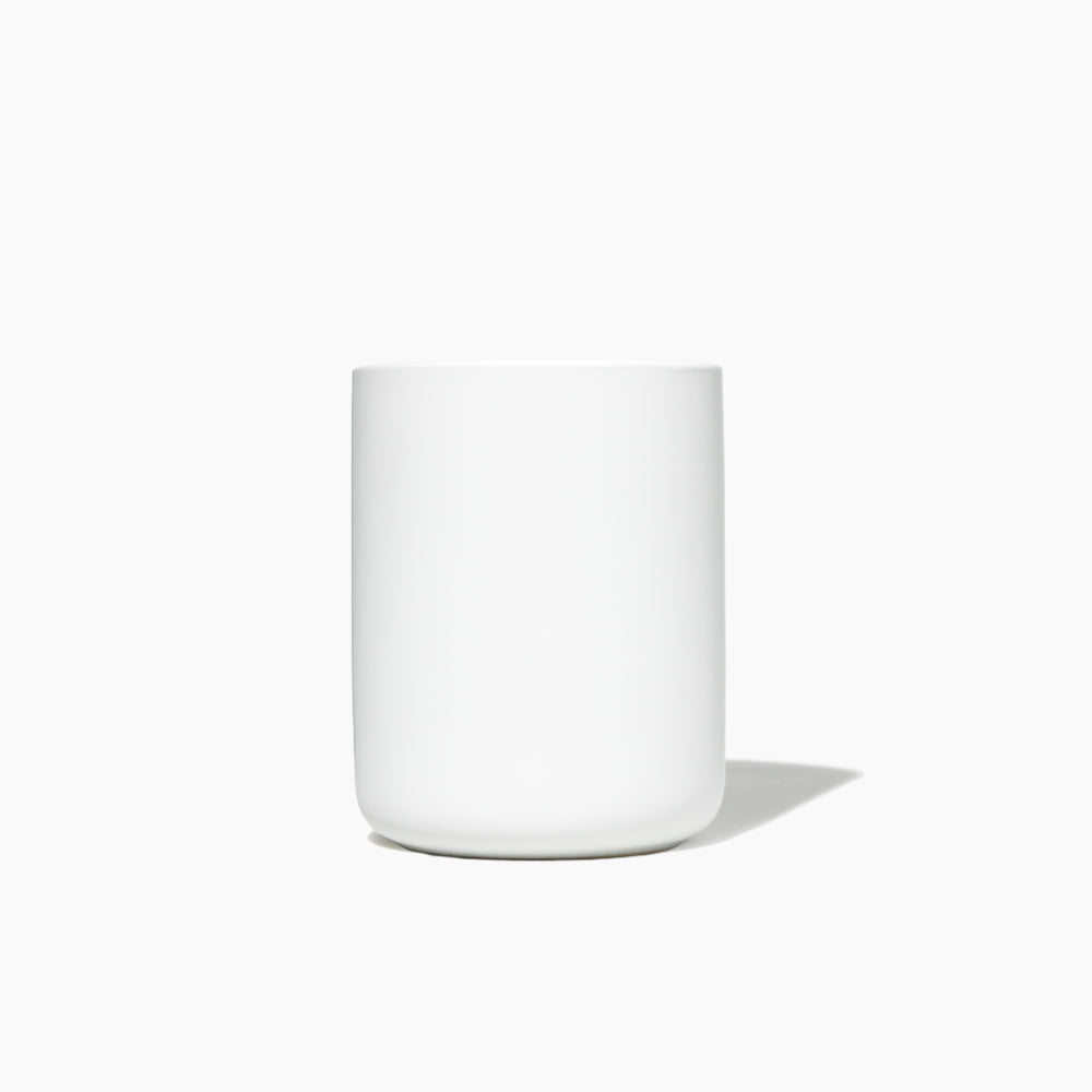 White ceramic cup on a white background