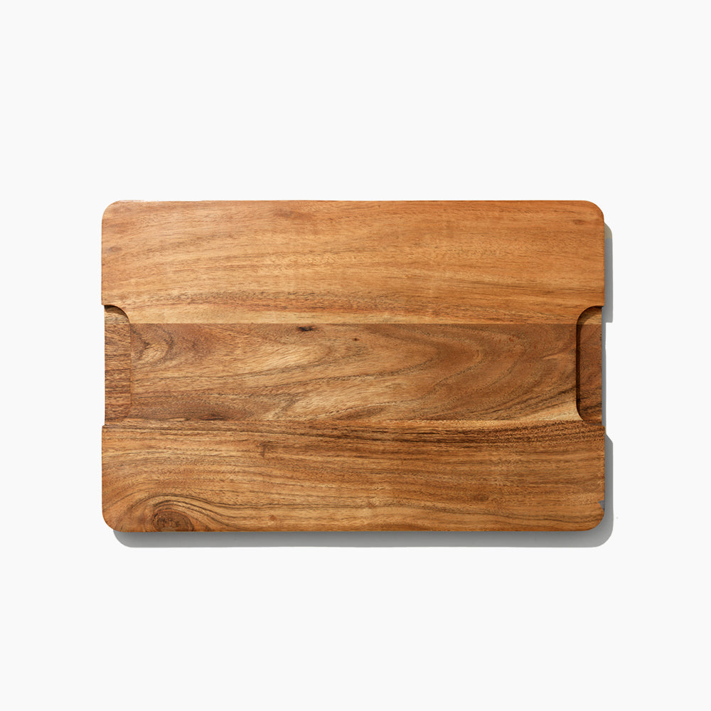 Wooden cutting board on a white background