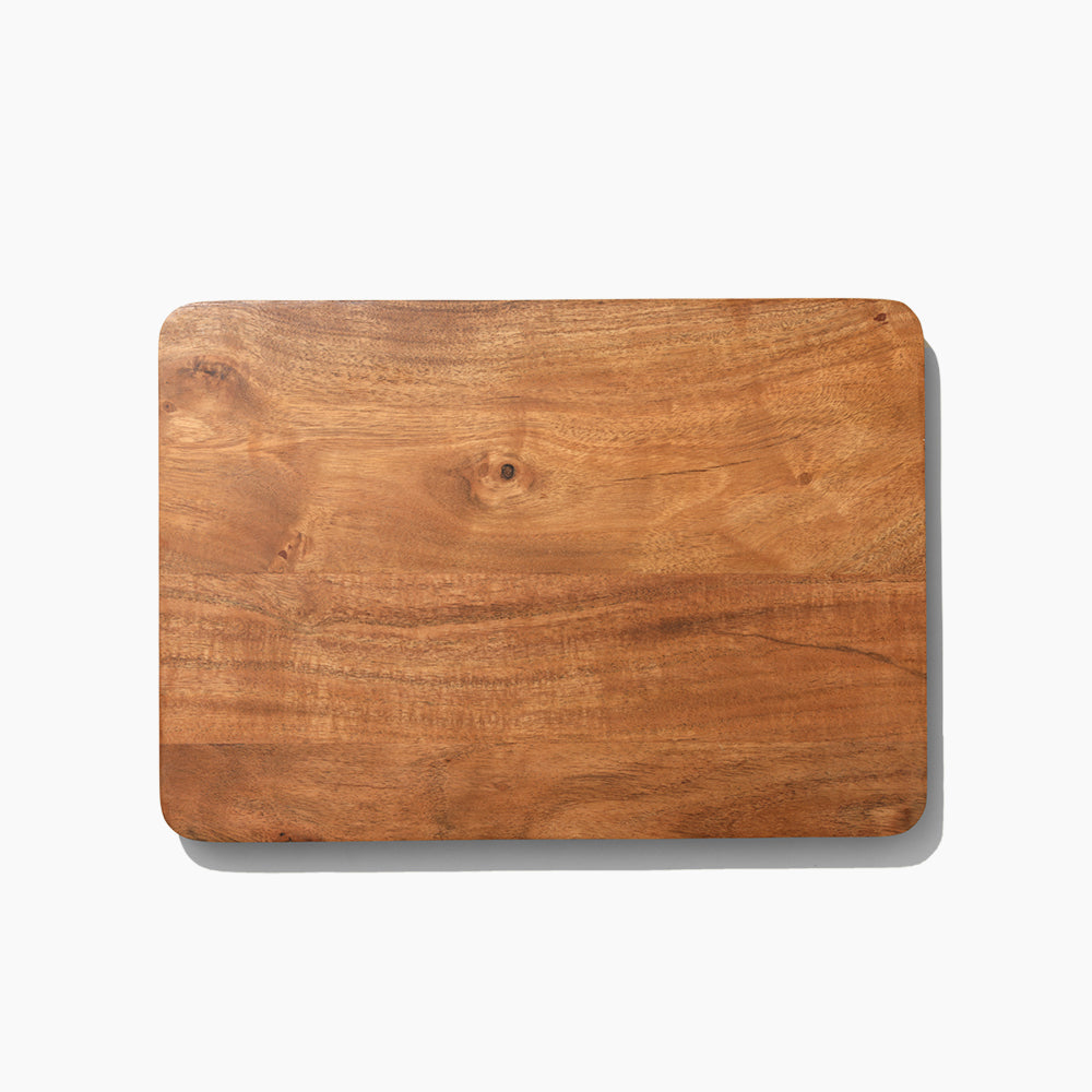 Wooden cutting board on a white background